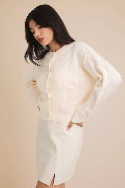GILLI Camille cable knit cardigan sweater with long sleeves and button closure, in a cozy, textured knit pattern.