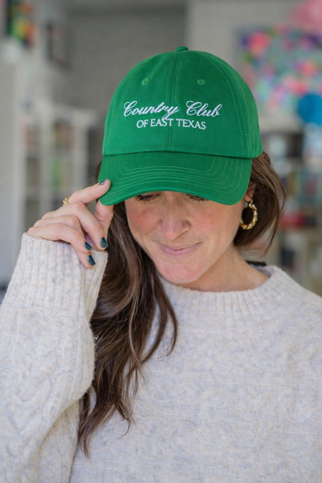 Bluebird & Co. Augusta Club Hat featuring a classic design with a wide brim and stylish details in a natural outdoor setting.