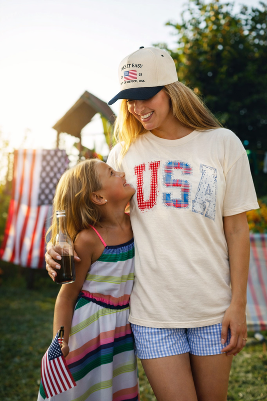 Poppy & Pine Patchwork USA graphic tee showing a colorful patchwork design on a casual cotton T-shirt.