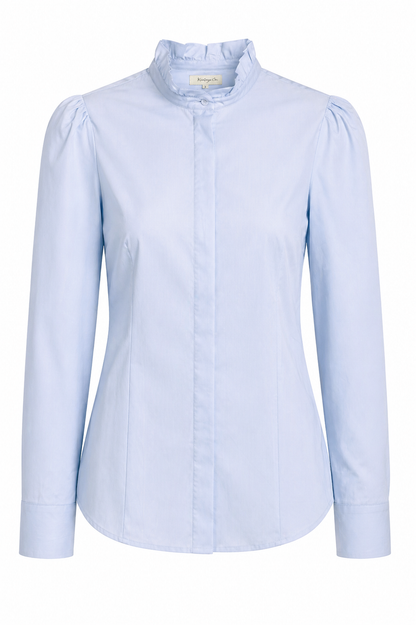 Aubrey Kathryn Co Brit Ruffled Blouse featuring delicate ruffles and a feminine design, styled as a fashionable women's top.