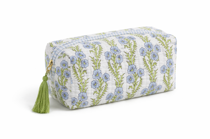 Inner Child Garden Blockprint cosmetic bag with colorful floral pattern, fabric exterior, and zipper closure.
