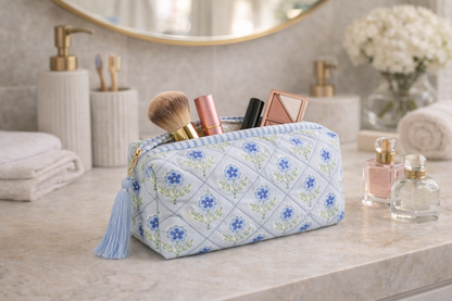 Inner Child Mona Blue Blockprint Cosmetic Bag with vibrant blue and white geometric design, soft fabric exterior, and zip closure.