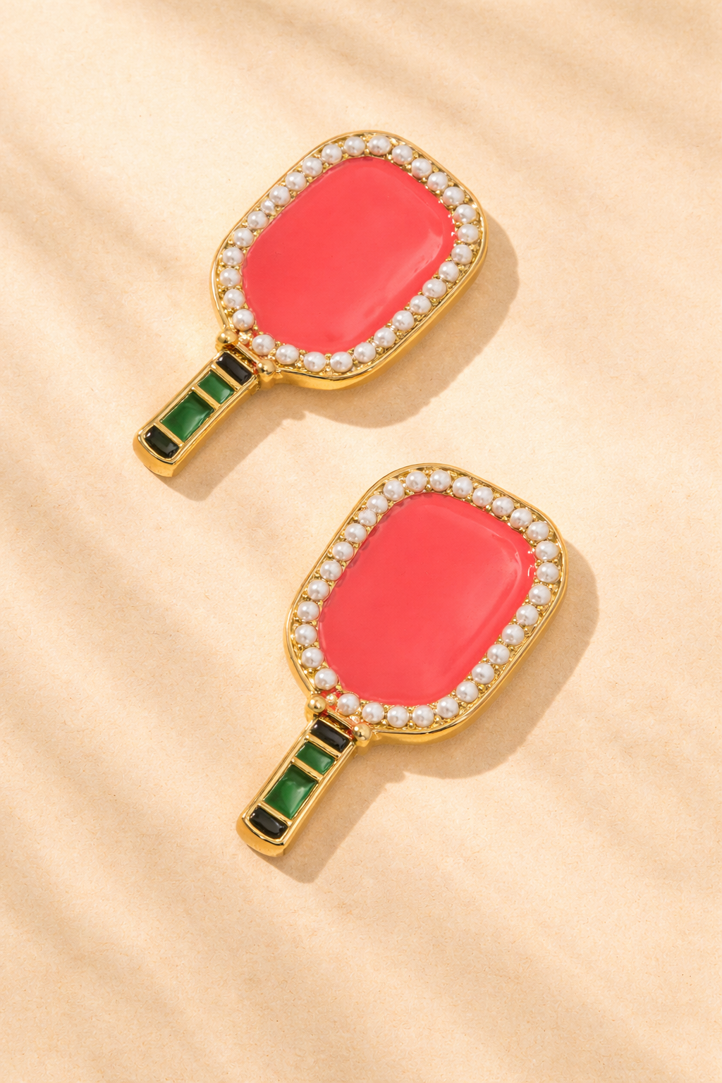Coral and gold Ellie pickleball paddle stud earrings from Canvas Style, jewelry featuring sporty-inspired design with paddle motifs.