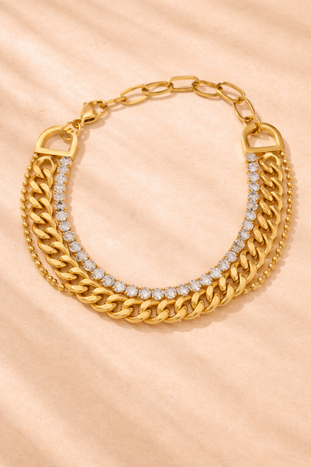 Gold water-resistant statement bracelet with layered chain design, elegant jewelry piece from Splendid Iris