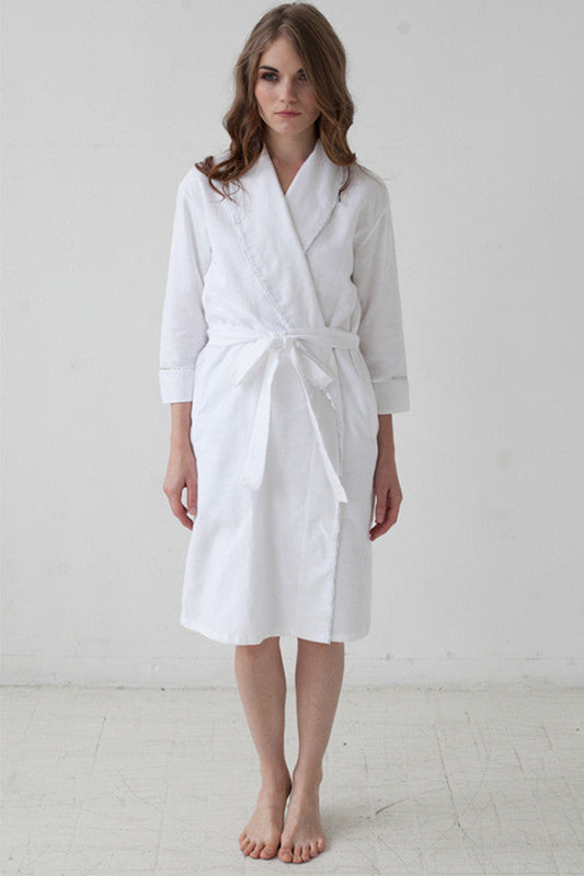 Salua Lingerie classic flannel robe with piping, soft and cozy, displayed hanging with a relaxed fit and plaid pattern.