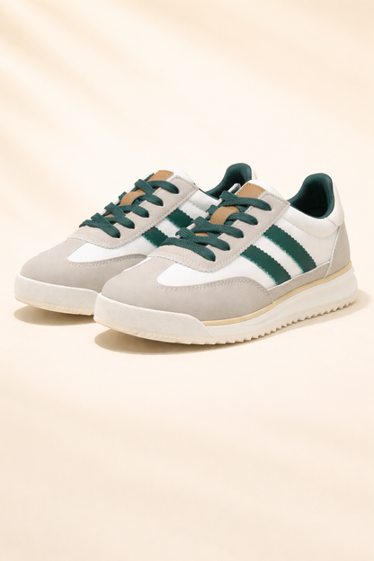 Cereza retro running trainers sneakers on yellow background, showcasing classic athletic footwear design and vibrant color.