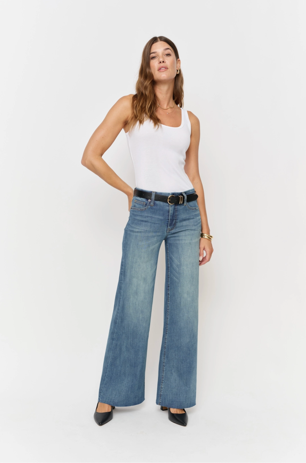 Oliver Logan Crawford vintage denim bottoms featuring mid-rise fit and wide-leg, sculpted for a stylish, fitted look.