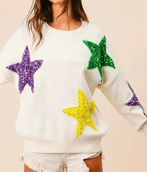 BIBI Mardi Gras velvet sweater with sequin star patches, cozy knit top featuring festive star embellishments.