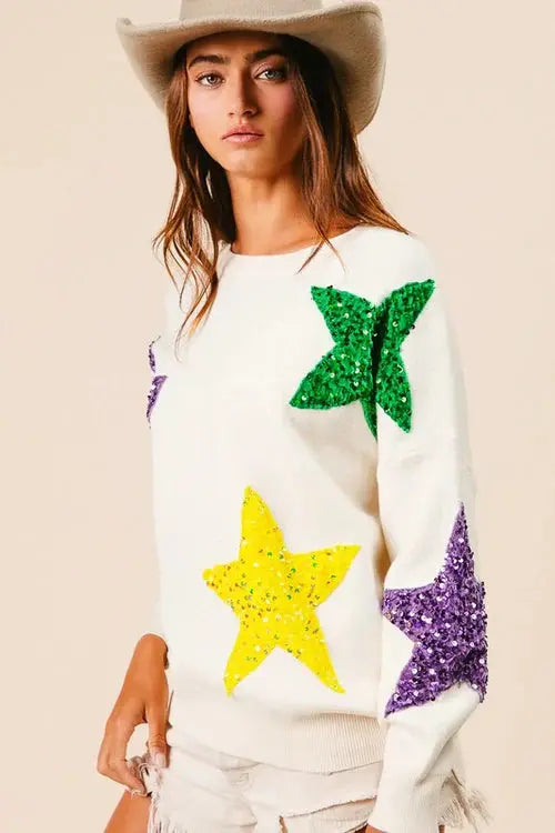 BIBI velvet sweater with gold sequin star patches, long-sleeve design, soft fabric, perfect for festive or casual wear.