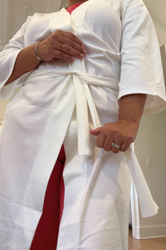Leena & Lu Pima short robe in soft, breathable fabric, displayed hanging with a relaxed fit and stylish design.