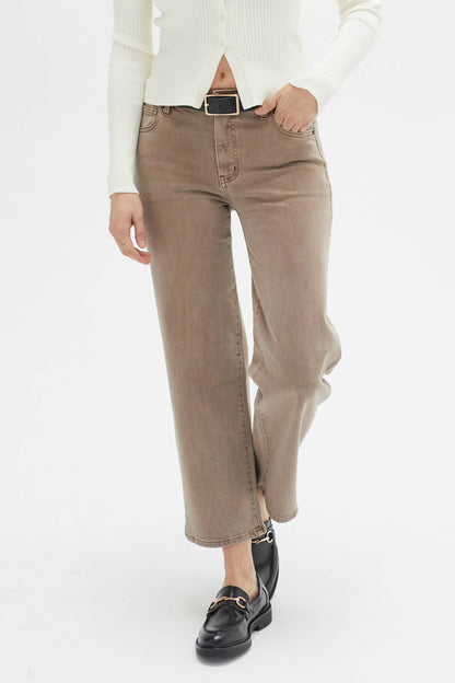 Oliver Logan Addington ankle crop mid-rise jean in brown mix, showing the fitted bottoms with distressed details and rolled cuffs.