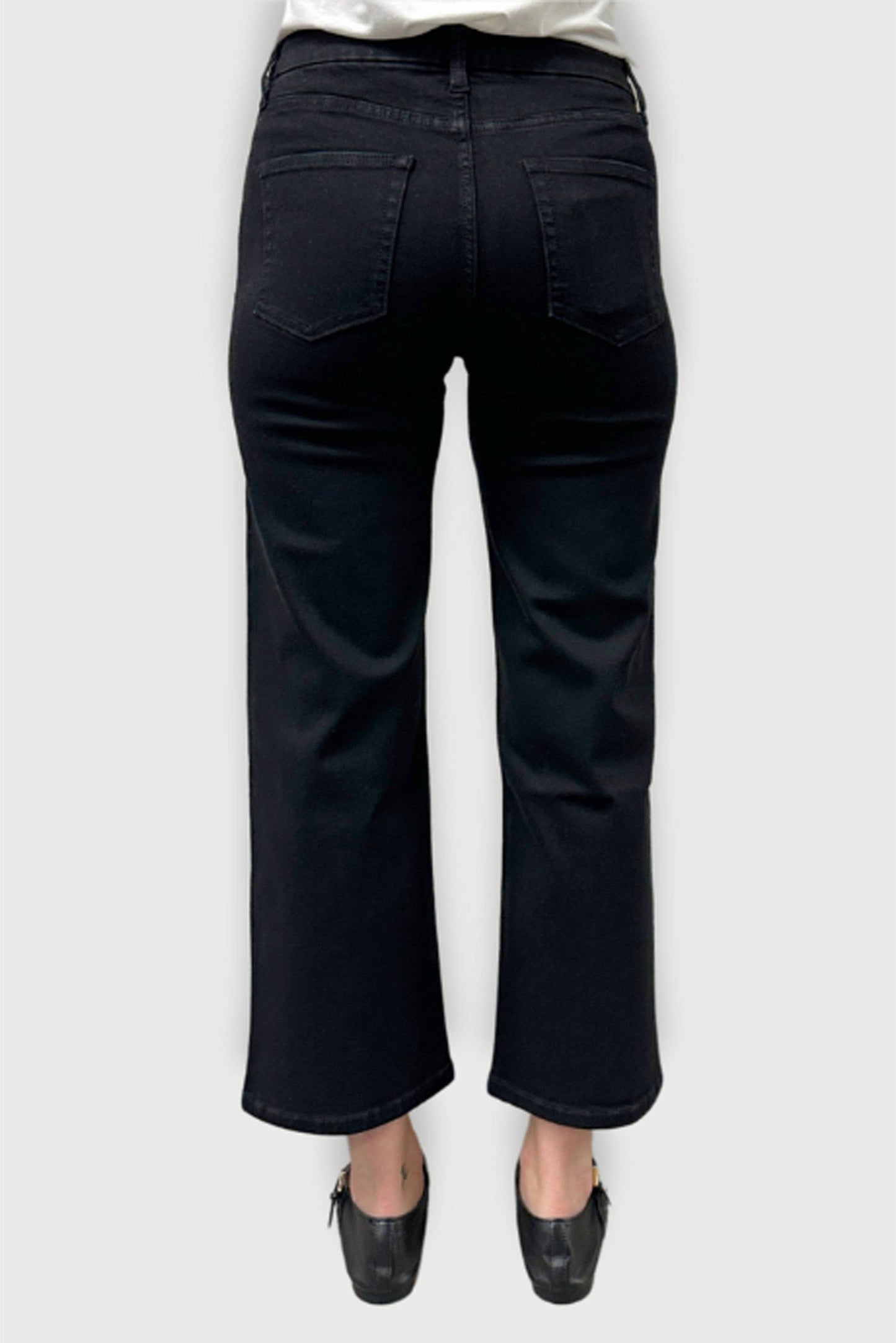 Oliver Logan Addington mid rise wide leg crop jeans in jet black, shown as stylish bottoms with a relaxed fit and cropped length.