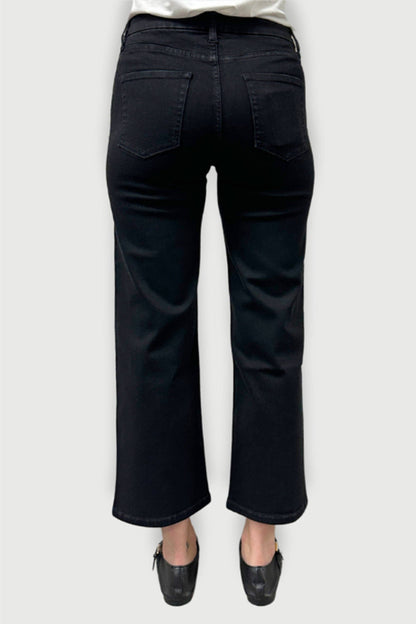 Oliver Logan Addington mid rise wide leg crop jeans in jet black, shown as stylish bottoms with a relaxed fit and cropped length.