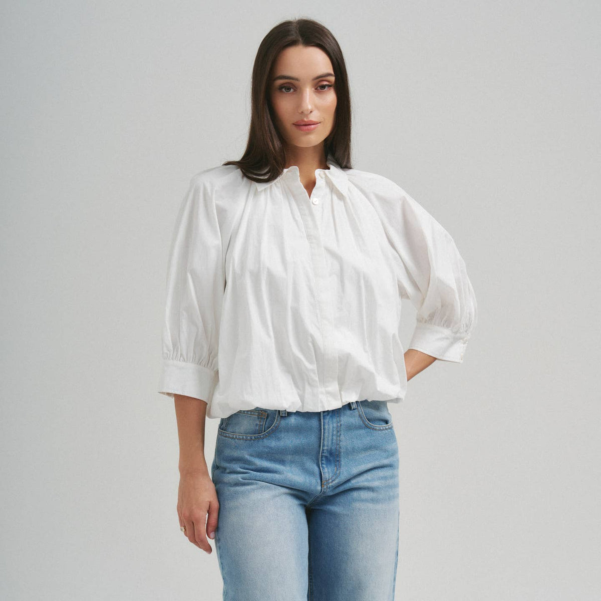 Able ivory 3/4 sleeve bubble hem blouse with relaxed fit and gathered hem detail