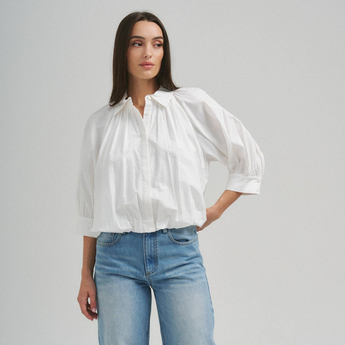 Able ivory 3/4 sleeve bubble hem blouse with relaxed fit and soft drape