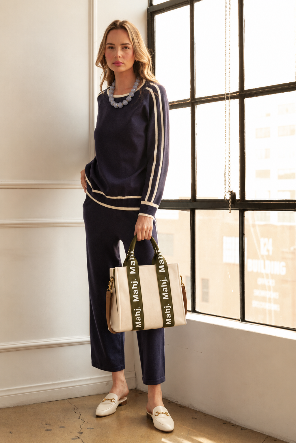 Navy sweater top and matching knit pants with cream striped trim