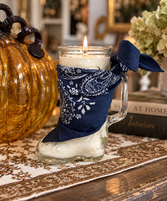 She's From Texas candle in a glass cowboy boot with navy bandana