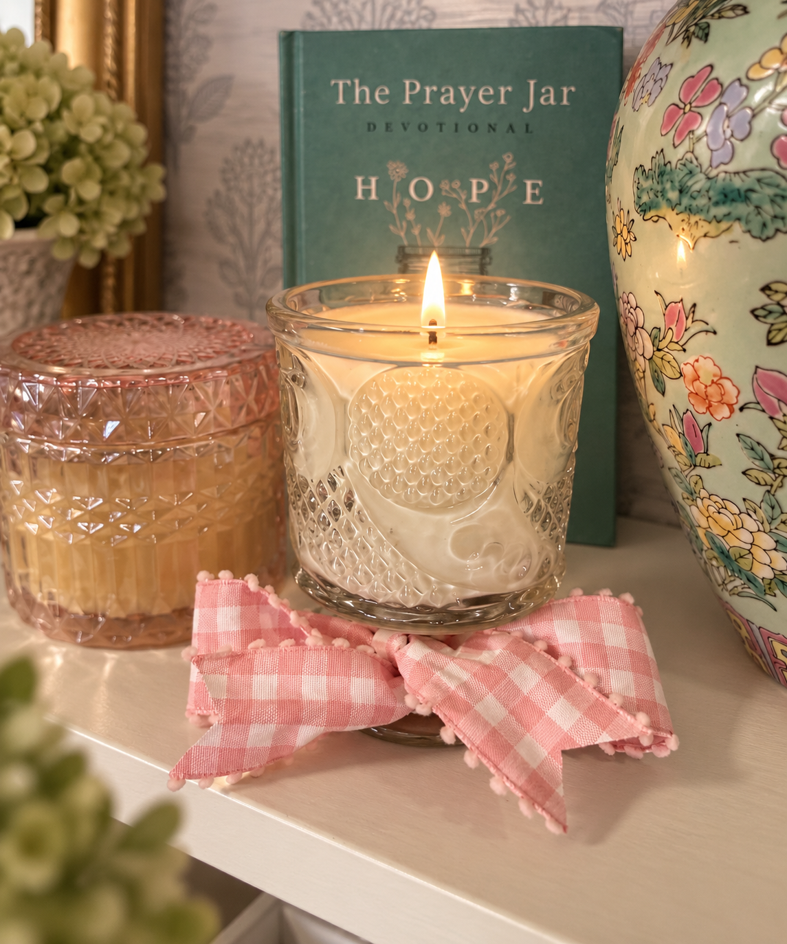 The Village candle in a one-of-one vintage pedestal glass with pink gingham bow