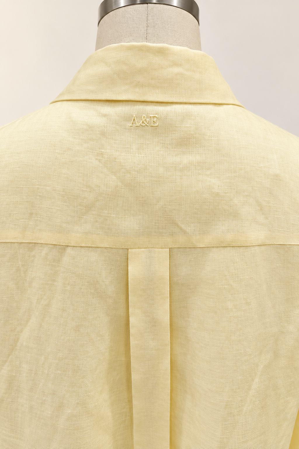 Alice & Elizabeth butter yellow linen dress — tonal A&E embroidery below the back collar