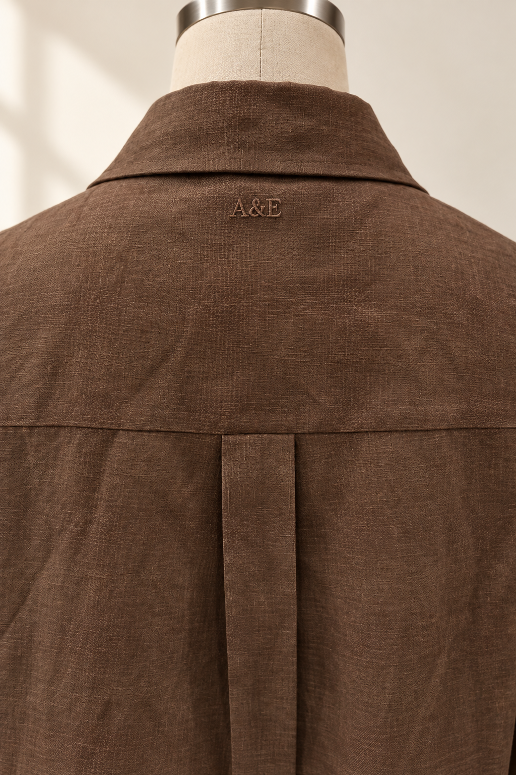 Alice & Elizabeth chocolate brown linen dress — tonal A&E embroidery below the back collar