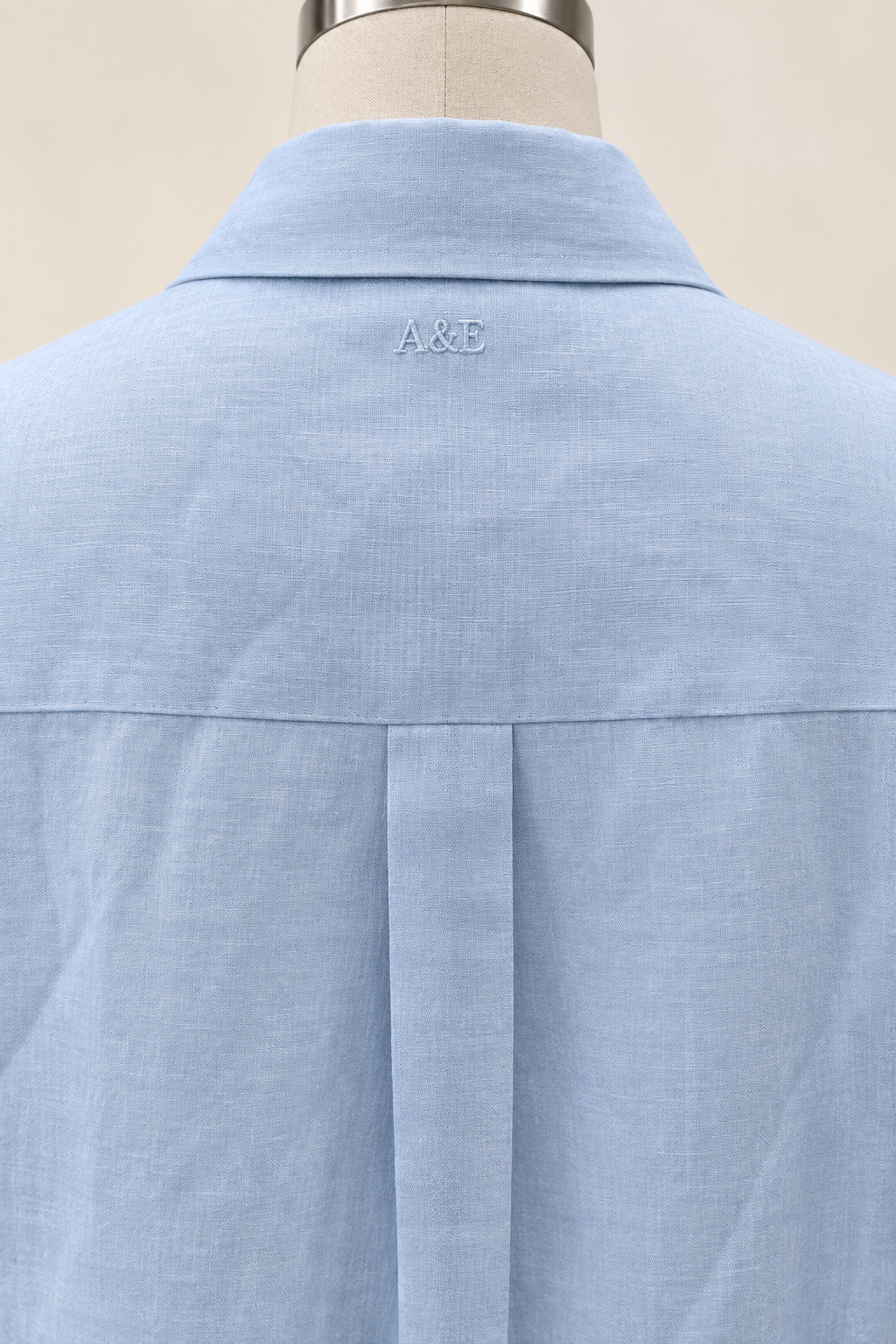 Alice & Elizabeth powder blue linen dress — tonal A&E embroidery below the back collar