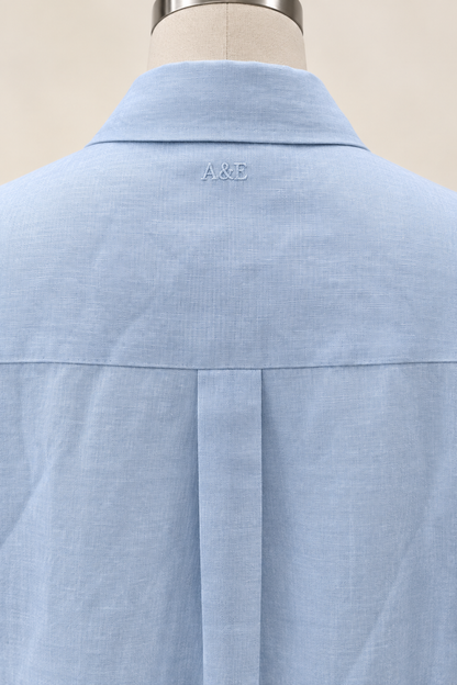 Alice & Elizabeth powder blue linen dress — tonal A&E embroidery below the back collar