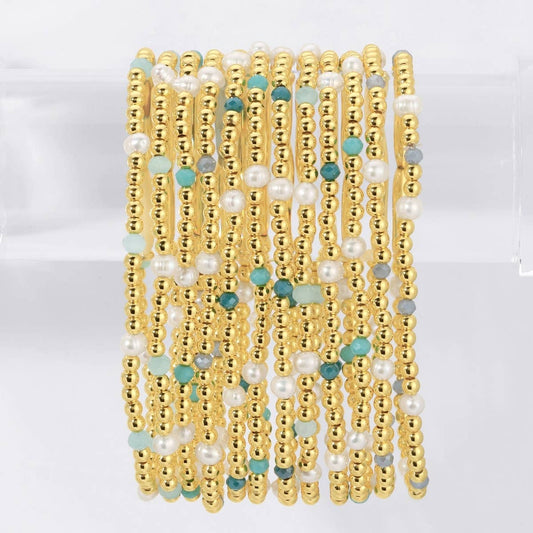 Splendid Iris Carolina Pearl Stack Bracelet featuring multiple white pearl strands and silver accents on a delicate jewelry design.