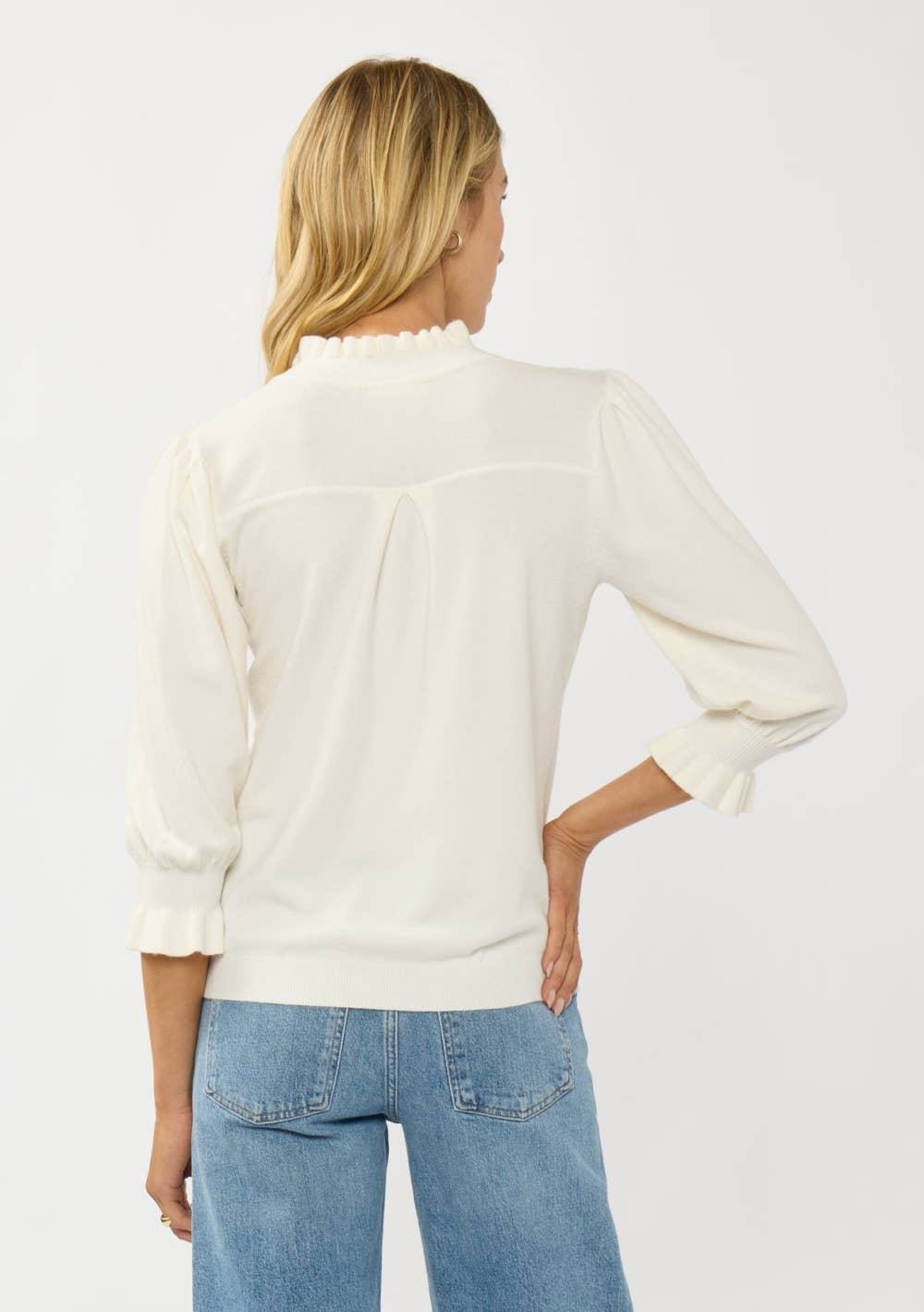 Cream Lovestitch Margot 3/4 sleeve button sweater top with a relaxed fit and cozy knit fabric, shown on a model.