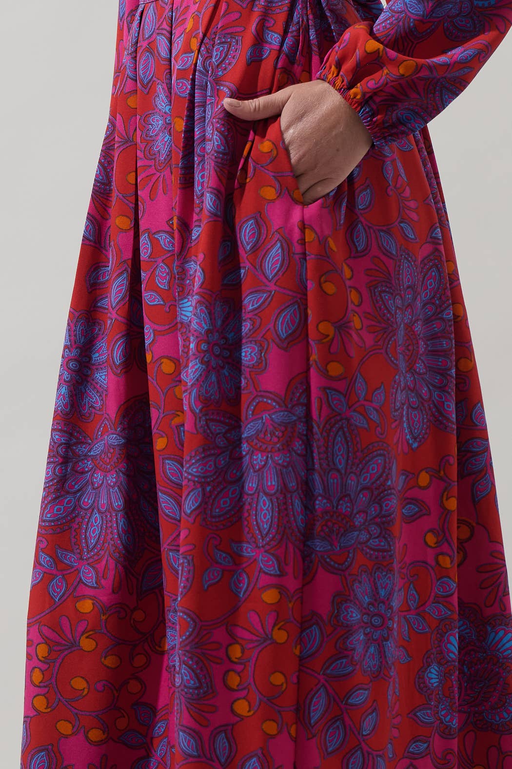 Sugarlips Darret Floral Lucie pleated maxi skirt in fuchsia multi, featuring a vibrant floral pattern and flowing pleated design.