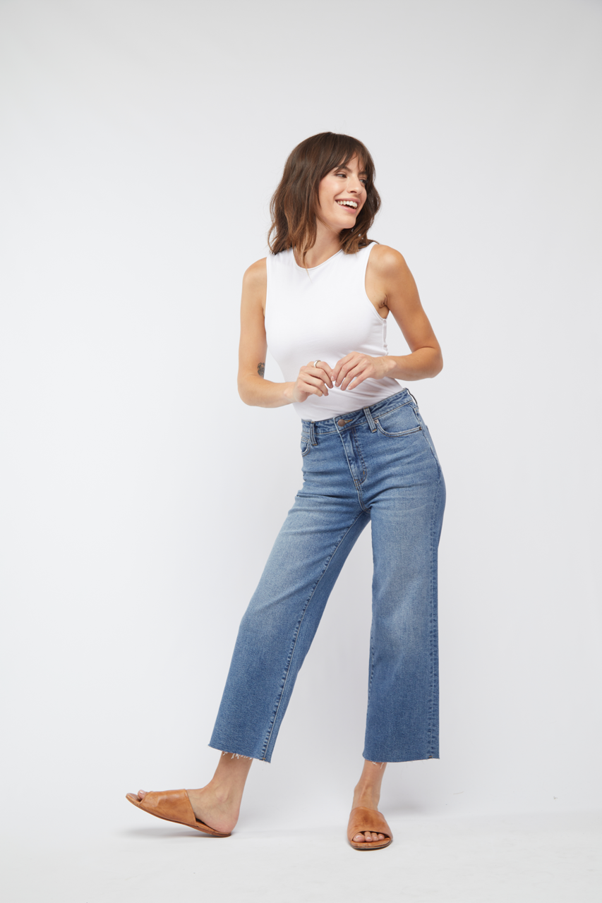 Oliver Logan Aberdeen Ankle Crop High Rise Jean in standard wash, showcasing fitted ankle-length denim bottoms with high waist.