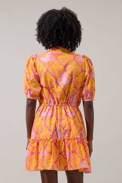 Sugarlips Jaidy Stacie button-down mini dress shown on a model, featuring a stylish collar, long sleeves, and a fitted silhouette.