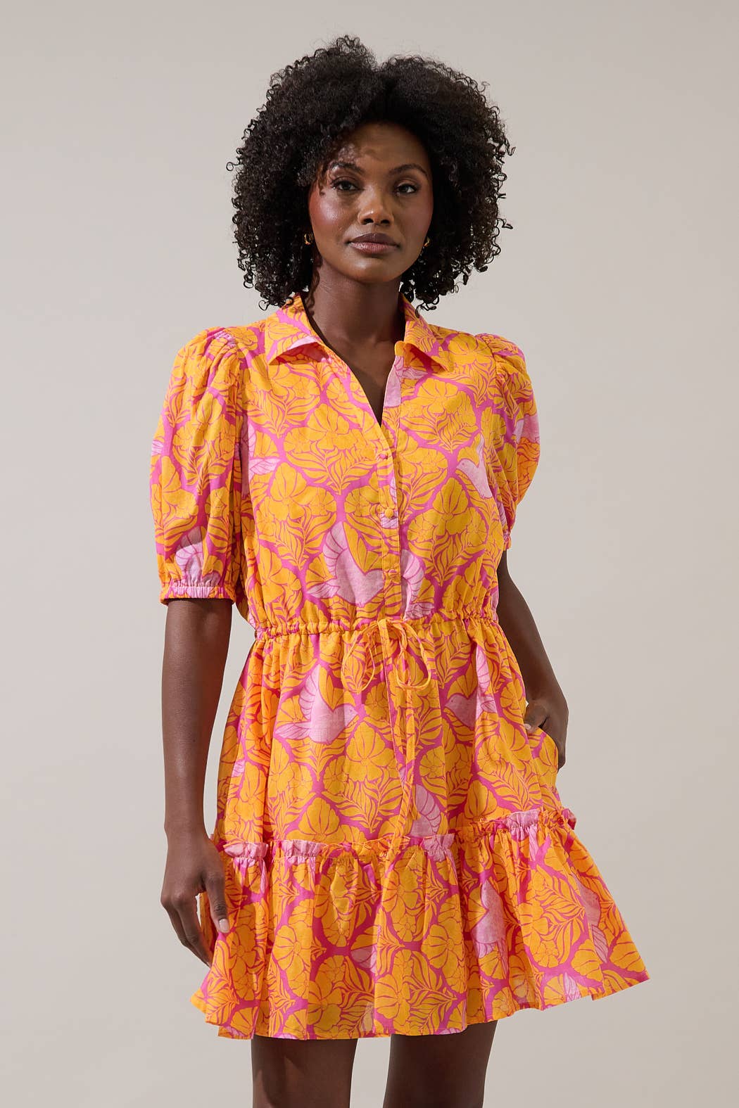 Sugarlips Jaidy Stacie button-down mini dress in floral print, featuring long sleeves and a fitted silhouette.