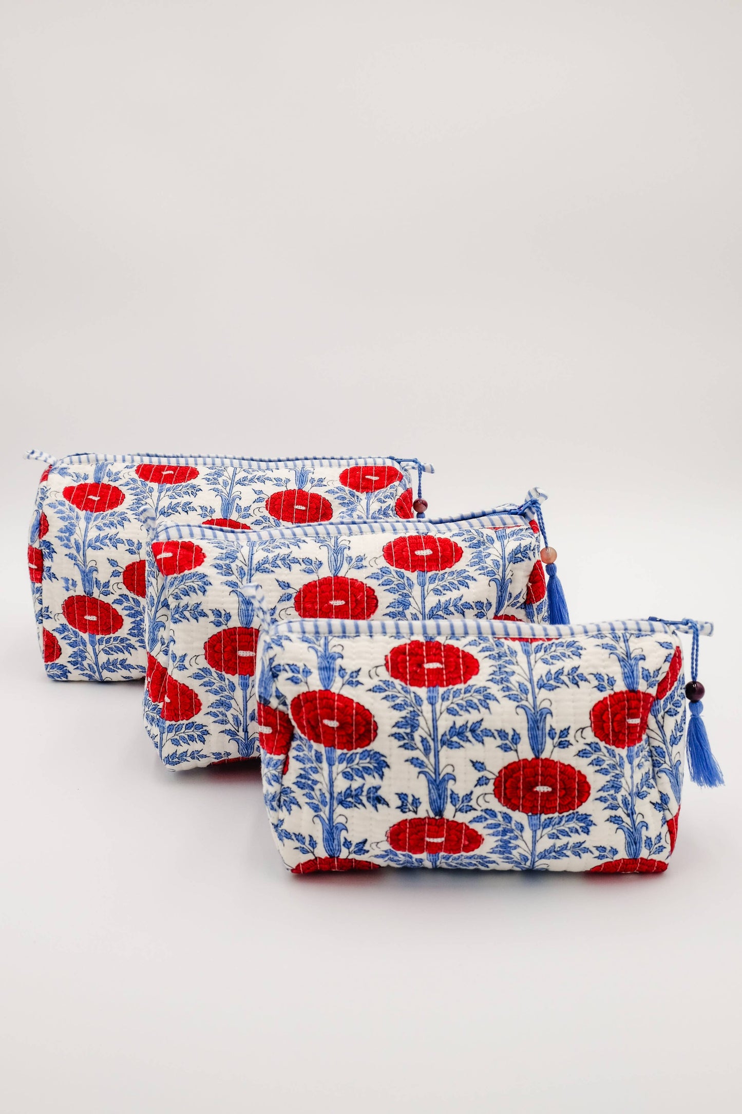 Inner Child Araminta Bloom Medium Toiletry Bag with floral print and zipper closure, made of durable fabric.