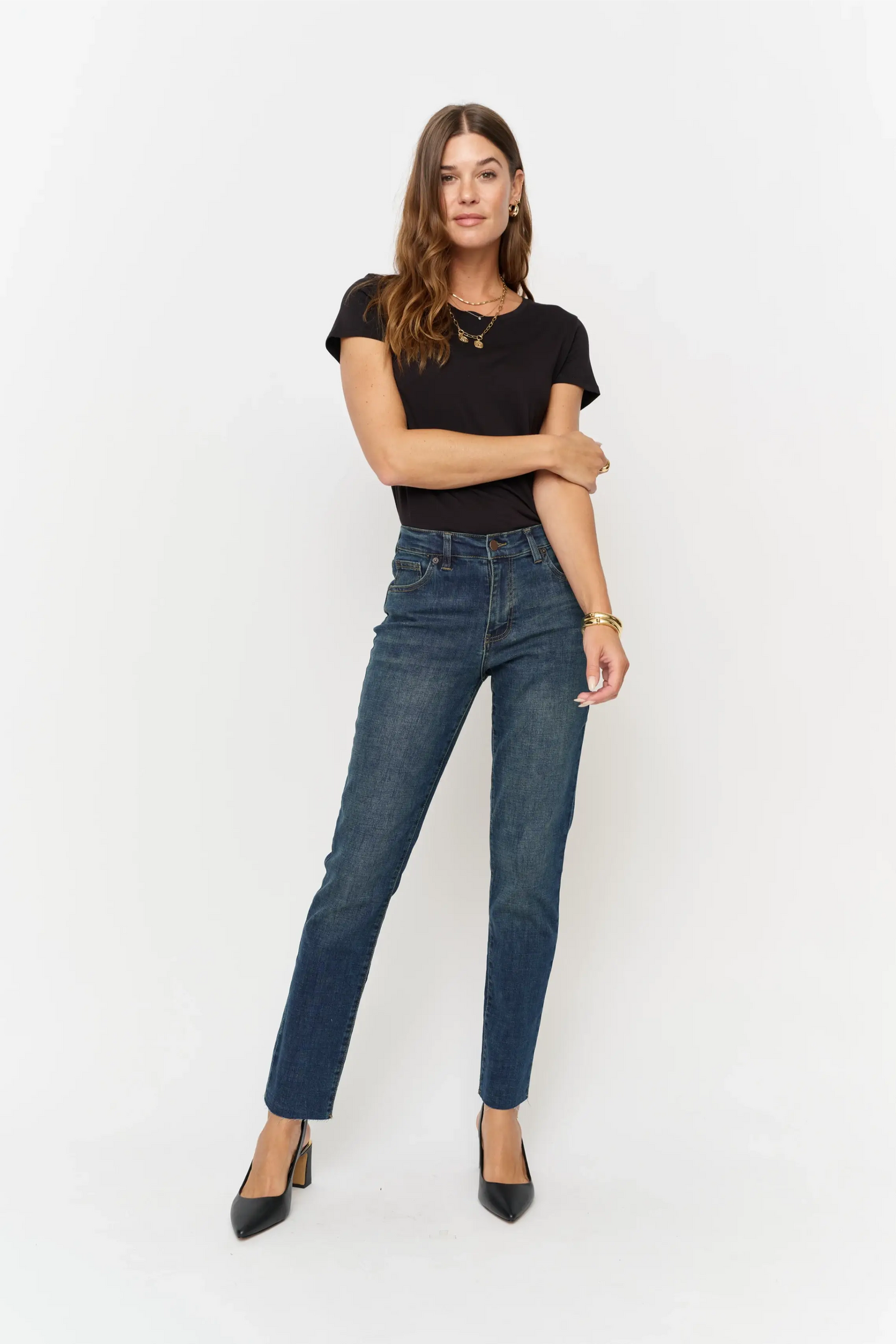 Oliver Logan Crosby Mid Rise Relaxed Taper Jean in standard wash, showcasing the denim's fit and classic style on a model.