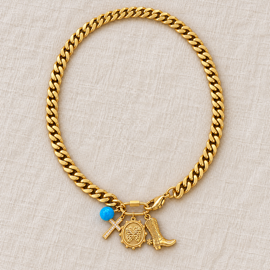 Alice & Elizabeth Texas Butterfly & Cross charm necklace featuring a delicate butterfly and cross pendant on a chain.