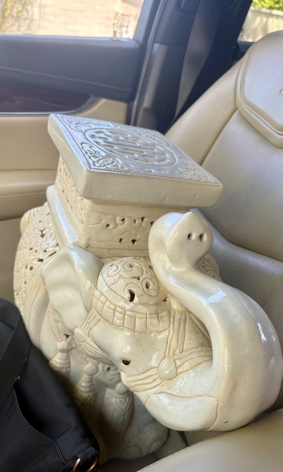 Fisher House Antiques elephant-shaped wooden stool for home decor, featuring detailed carved elephant design and sturdy construction.