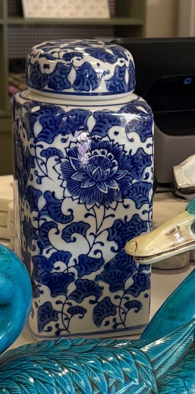 Blue and white chinoiserie lidded jar with floral design, decorative home accent piece featuring intricate patterns and a lid.