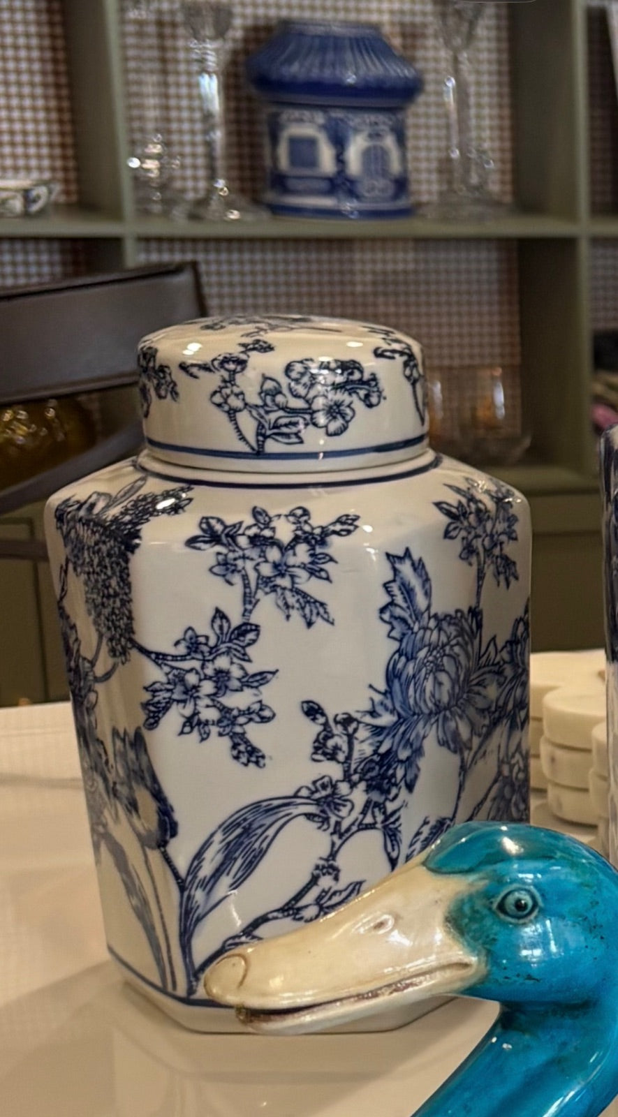 Blue and white Chinoiserie lidded jar with scenic design, decorative home accent featuring intricate Asian-inspired patterns.