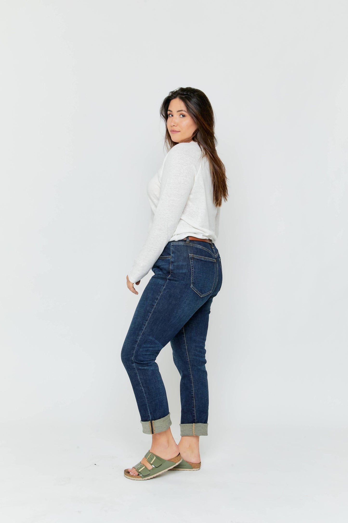 Oliver Logan Crosby mid-rise relaxed taper jeans in standard wash, showing the denim fabric, tapered fit, and relaxed style.