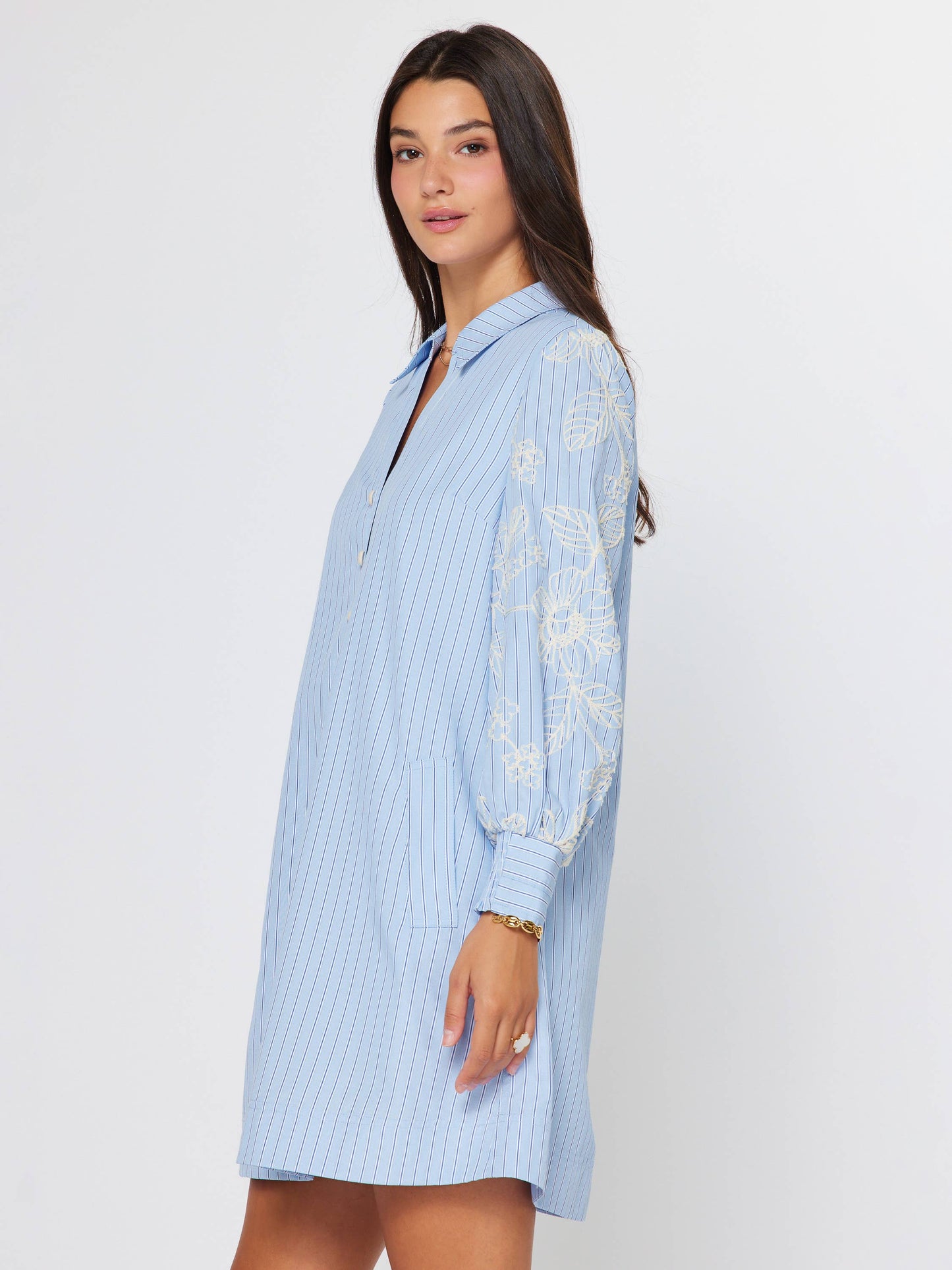 Current Air Eloise embroidered misty blue dress with delicate embroidery and flowing fabric, displayed on a mannequin.