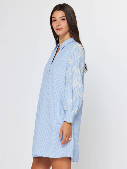 Current Air Eloise embroidered misty blue dress with delicate embroidery and flowing fabric, displayed on a mannequin.