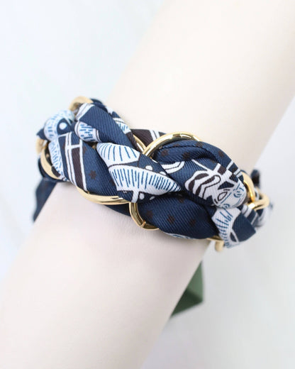 Caroline Hill Fontana Chain Scarf Bracelet in navy silk twist, stylish accessory featuring a chain design and elegant fabric.