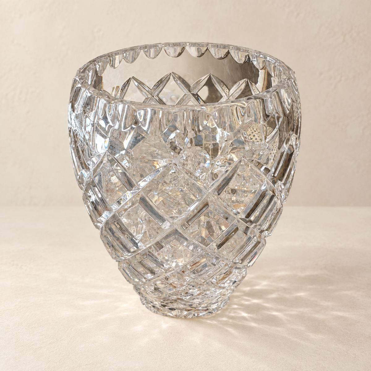 Cut Crystal Scalloped Vase on warm ivory background