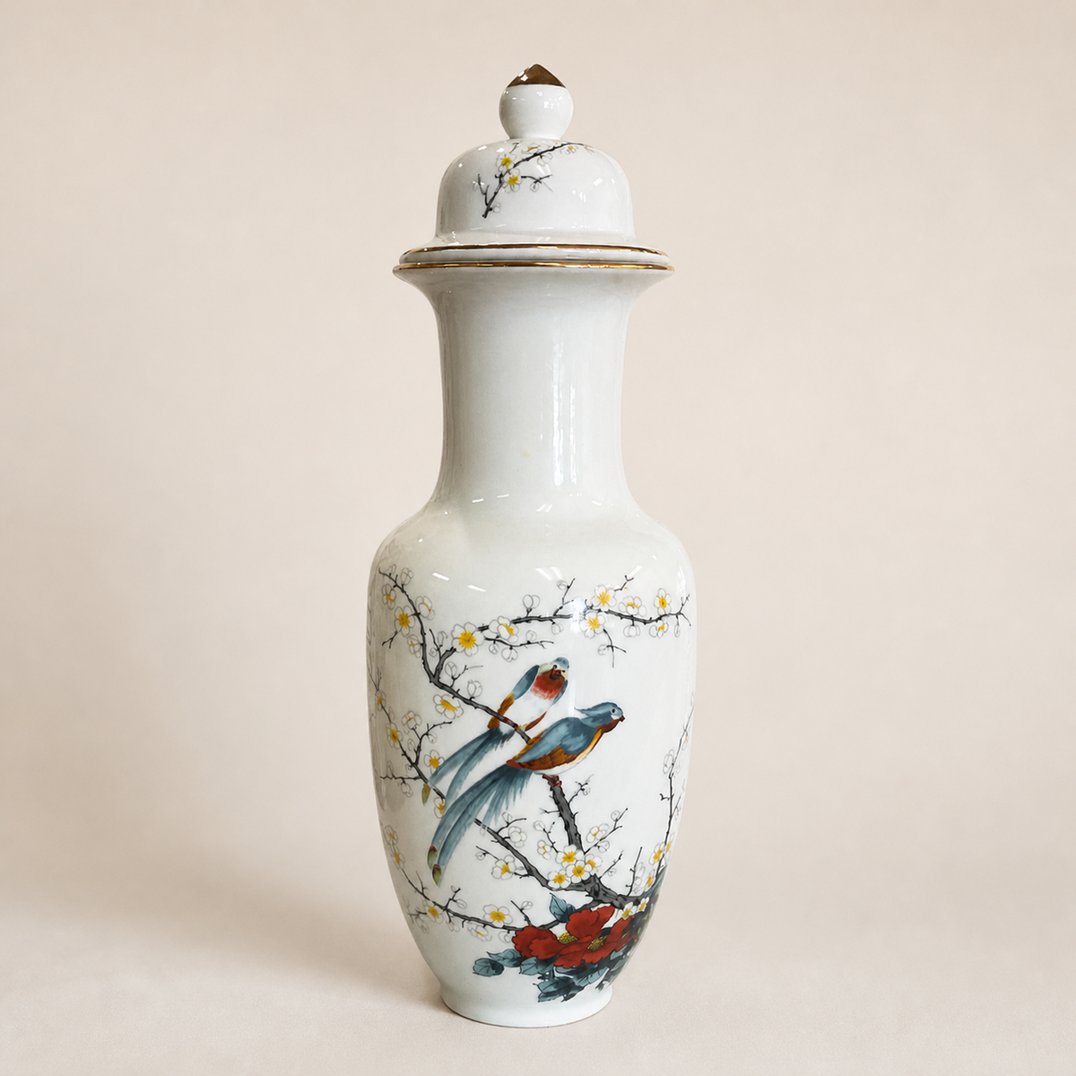 Japanese chinoiserie bird and blossom ginger jar on an ivory studio background