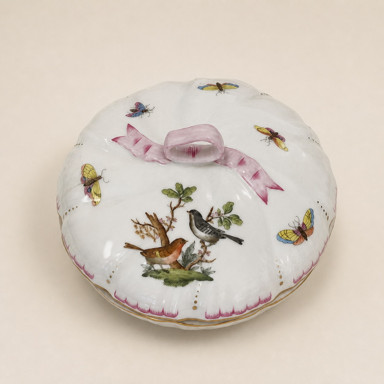 Herend Rothschild Bird lidded box on an ivory studio background