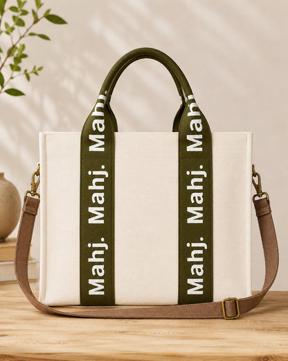 The Mahj Bag in Olive, front view with shoulder strap