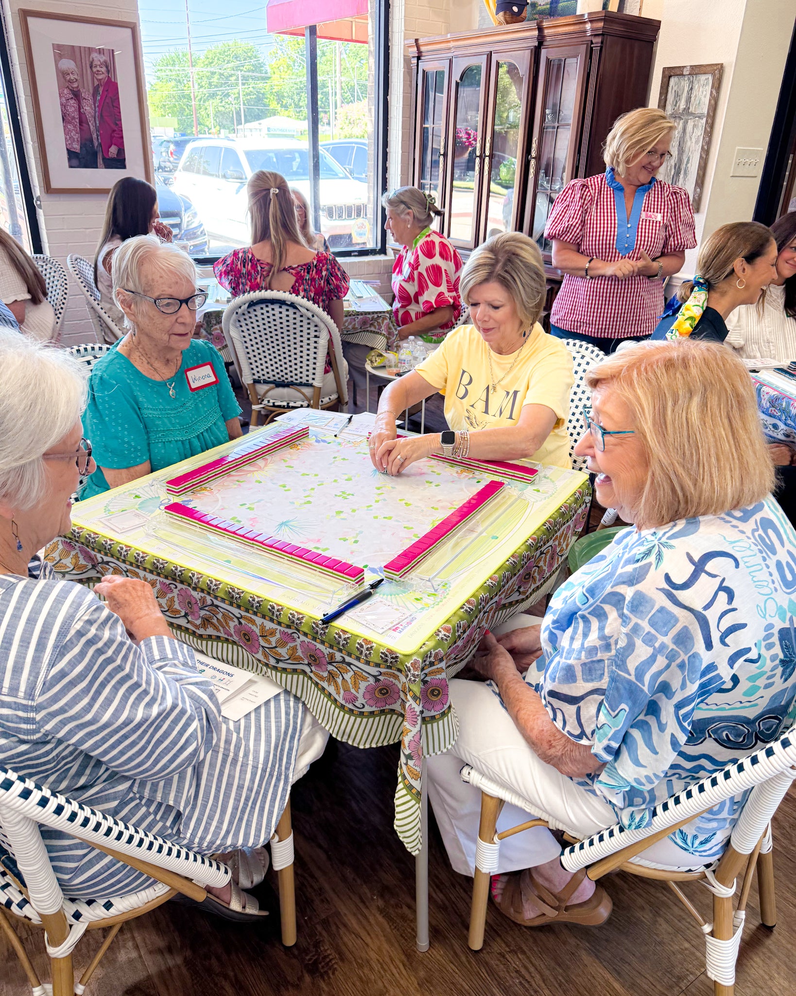 Women enjoying Mahjong together at Alice & Elizabeth