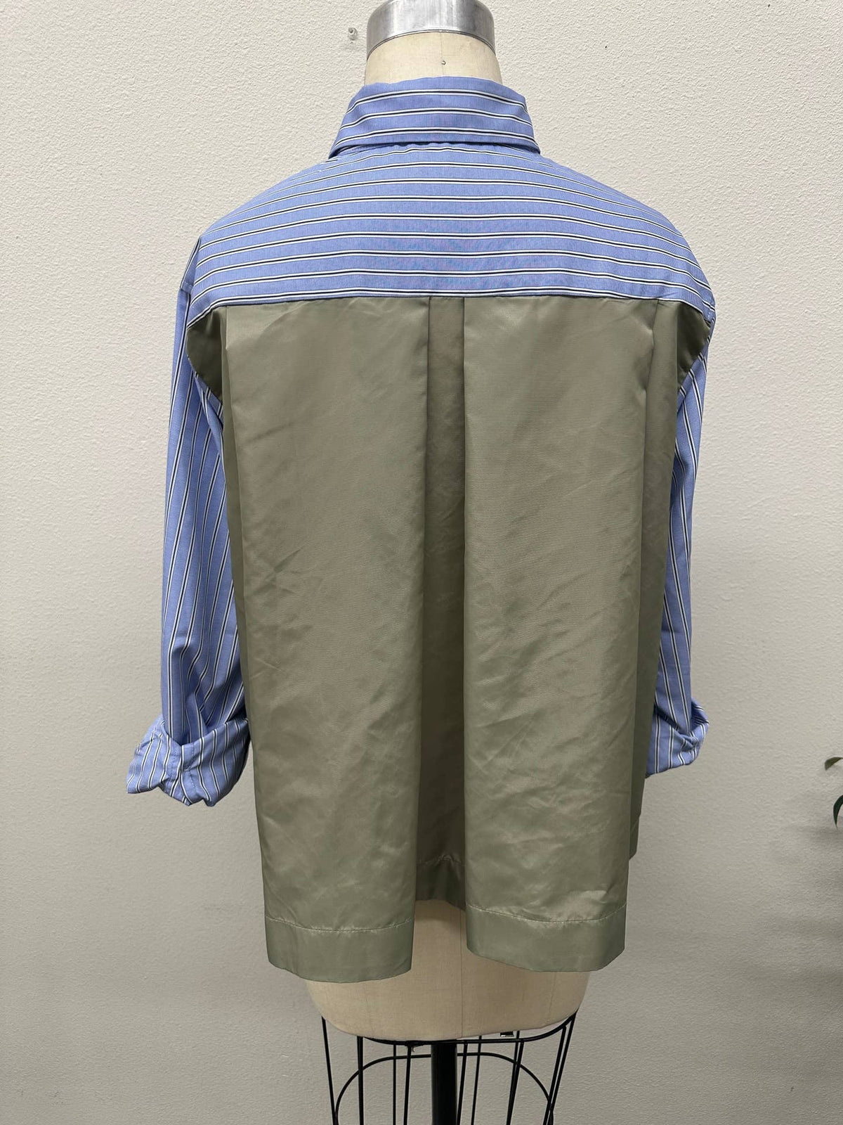 Mila blue contrast back stripe shirt by Brad & Rena Apparel, showing its striped back detail