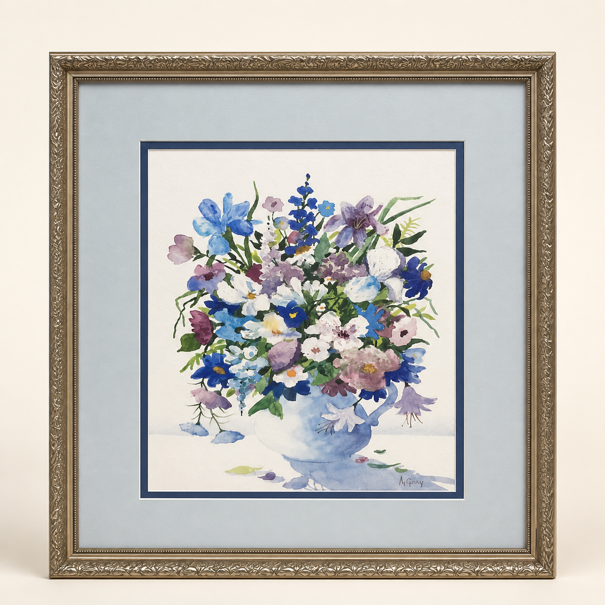 Signed M. Gray wildflower watercolor in decorative frame on an ivory studio background