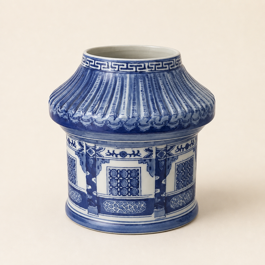 Pagoda-form blue and white vase on an ivory studio background